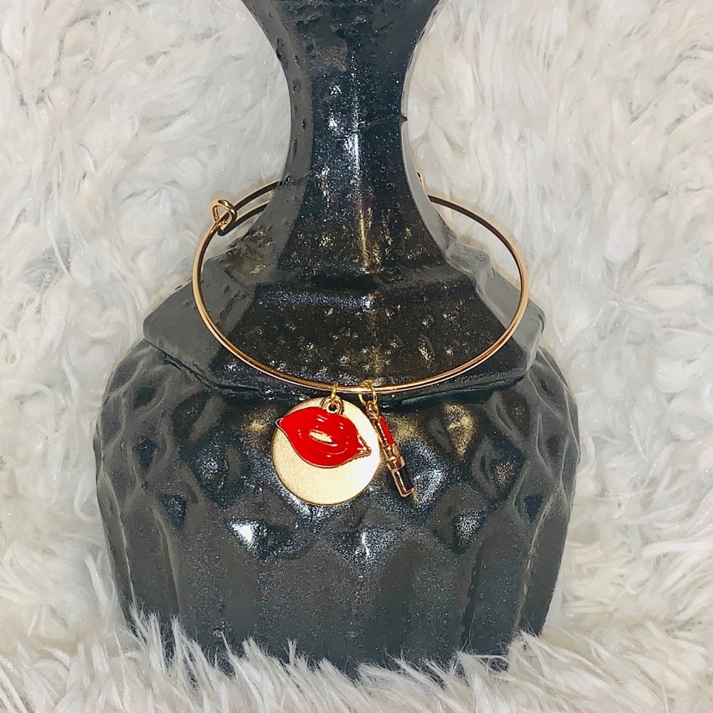 Gold bangle with charms